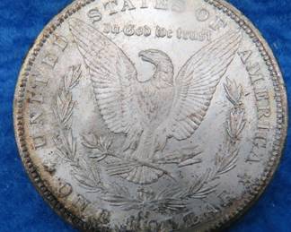 Lot 16. 1884 CC Morgan Silver Dollar. This coin was discovered in 1964 as part of a Treasury audit.