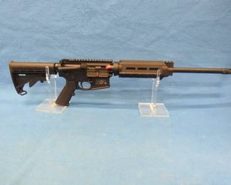 Lot 30. Smith & Wesson .223 AR Model M&P-15. Ser. No. TT03105. Includes padded case, four magazines, and original shipping box. Scope in lot 379.