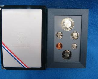 Lot 44. 1990 Eisenhower 6-coin Proof Prestige set including a 90% silver dollar weighing 26.73 grams