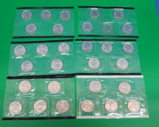 Lot 180. Six uncirculated coin sets: 2000 quarters, and full sets from 2001, 2002, 2003, 2004, and 2005