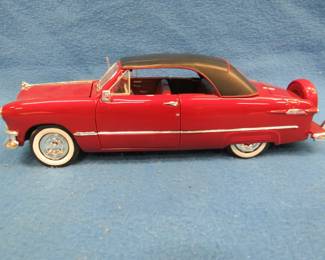 Lot 343. Maisto 1950 Ford Closed Top Convertible. 1:18 scale die-cast car with original box.