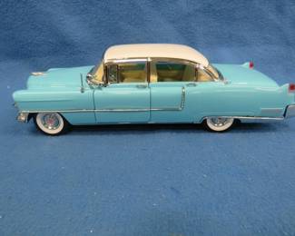 Lot 275. Artisan 1955 Cadillac Fleetwood Series 60. 1:18 scale die-cast car.