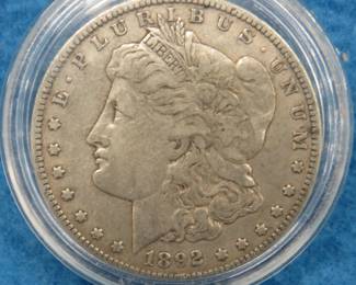 Lot 21. 1892 O Morgan silver dollar