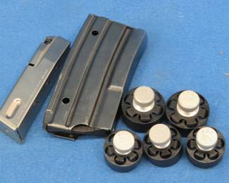 Lot 286. Speed loaders and magazines including a PB cal. 9 short/380/auto mag and an unidentified mag