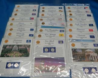 Lot 250. Twenty-four different State Presentation cards each of which includes the state quarters from Denver and Philadelphia for that state, and more.