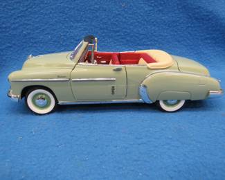 Lot 345. Mira 1950 Chevrolet Styleline convertible. 1:18 scale die-cast car with original box.