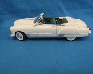 Lot 76. Road Legends 1949 Cadillac Coupe de Ville. 1:18 scale die-cast car with original box.