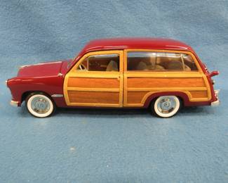 Lot 78. Motor City Classics 1949 Ford Woody Wagon. 1:18 scale die-cast car.