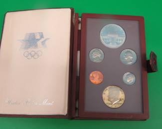 Lot 182. 1984 Olympic Prestige set including all proof issue coins and a 90% silver dollar with .7734 oz. of actual silver weight. No COA