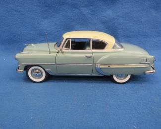 Lot 271. Sun Star 1953 Chevrolet Bel Air hardtop. 1:18 scale die-cast car.