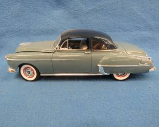 Lot 74. AW 1950 Oldsmobile Rocket 88. 1:18 scale die-cast car with original box.