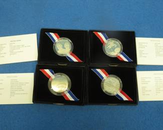 Lot 416. Four commemorative uncirculated half-dollar coins: