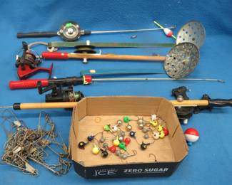 Lot 200. Ice fishing rods, one-ounce jigs, reels, ice scoops, stringer, and bucket