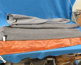 Lot 126. One vinyl and four soft padded gun socks