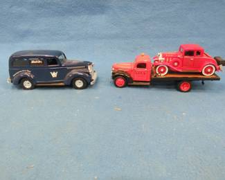 Lot 399. Watkins logo car with a locking compartment underneath and a 1:32 scale National Mint 1941 Chevrolet flatbed with a 1932 Chevrolet Roadster.