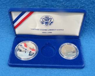 Lot 99. 1986 Proof Liberty 90% silver dollar weighing 26.73 gr., and a 1986 Proof copper/nickel half dollar. No gold coin.