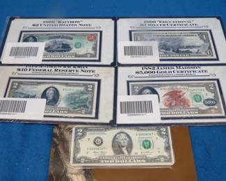 Lot 421. Three colorized $2 bills, one colorized $1 bill, and one $2 Star Note with serial {{{}}{#}{}} 00008767