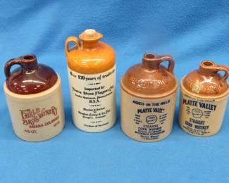 Lot 122. Four stoneware whiskey jugs in excellent condition
