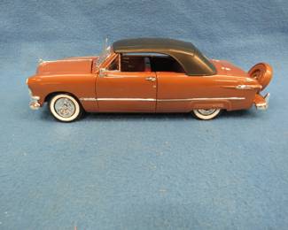 Lot 344. Maisto 1950 Ford Closed Top Convertible. 1:18 scale die-cast car with original box.