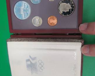 Lot 183. 1984 Olympic Prestige set including all proof issue coins and a 90% silver dollar
