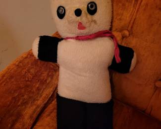 Vintage teddy bear with tumbler inside