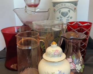 Floral pitcher is plastic with chips on lid 6 x 10 in. 
Red vase pair 6 x 8 in. and 5 x 9 in.
Vtg Indiana cranberry/ruby red glass chip/dip set 10 x 5 in. and 5 c 3 in.
Vtg pink swirl pitcher 5 x 8 in.
Vtg Fenton designed for teleflora amethyst purple vase hand painted 4.5 x 8 in.
Vtg Jay import milk jug cookie jar 1996 7 x 11 in.