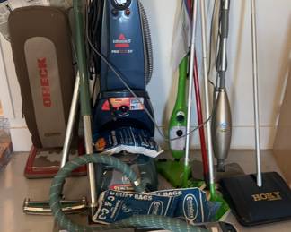 Electrolux with attachments 
Oreck upright vacuum
Swiffer dust mops (2)
Hoky (Oreck) manual carpet cleaner 
Bissell proheat2X carpet cleaner
H2Ox5 DualBlast floor mop
Shark floor mop (missing piece)