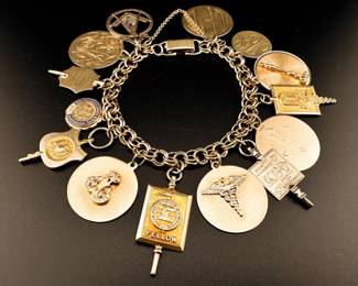 14k vintage charm bracelet. All charms are 14kt gold (tested or marked) except for Kappa Beta Phi charm which tests 10-12kt
