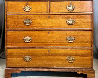 English oak chest of drawers with two over three drawers