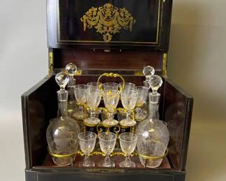 Continental black lacquered and bouille tantalus with etched decanters and cordials