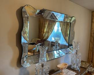 Large wheel cut wall mirror.