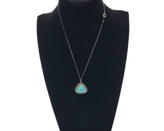 Rounded Triangle Sterling Silver Turquoise Pendant&nbsp;Necklace
Hallmark: Lady Belle
Pendant: L 2.6cm&nbsp; W 2.3cm
Weight: Grams 4.85&nbsp;
Estimated Melt Value 4.02 as of (01/07/2025)
Necklace: L 15"
Weight:&nbsp;1 gram&nbsp;Estimated Value: $0.98
Clasp: Spring Ring&nbsp;
Estimated Melt Value as of (01/07/2025)
Buyer is responsible to pay for Shipping and Ins (See Shipping Details)&nbsp;