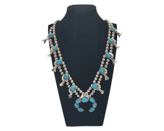 Vintage Navajo Turquoise Squash Blossom Necklace, Sterling Silver

L 28" long

Weight 104.43 Grams&nbsp;

Buyer is responsible to pay for Shipping and Ins (See Shipping Details)