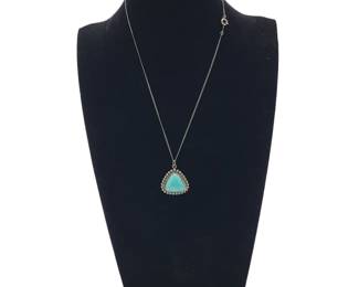 Rounded Triangle Sterling Silver Turquoise Pendant&nbsp;Necklace
Hallmark: Lady Belle
Pendant: L 2.6cm&nbsp; W 2.3cm
Weight: Grams 4.85&nbsp;
Estimated Melt Value 4.02 as of (01/07/2025)
Necklace: L 15"
Weight:&nbsp;1 gram&nbsp;Estimated Value: $0.98
Clasp: Spring Ring&nbsp;
Estimated Melt Value as of (01/07/2025)
Buyer is responsible to pay for Shipping and Ins (See Shipping Details)&nbsp;