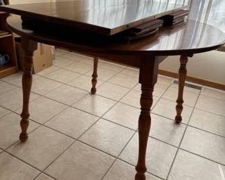 Beautiful maple table with 4 chairs in other picture, two leaves and pads