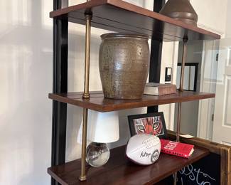 Tiered wood and metal shelf; Pat Dye signed football