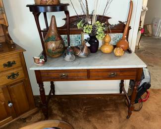Marble-topped table w/ tile back splash