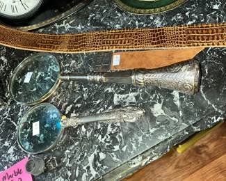 silvery handled magnifying glasses