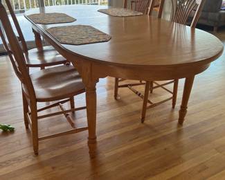 Oval dining table with chairs