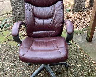 Leather desk chair. It raises and lowers, comes with wheels and can tilt back-and-forth.