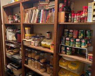 This is a peek into the pantry. Lots to choose from in here.! Vintage cookbooks, Tupperware, canned goods, ball, canning jars, and tops.