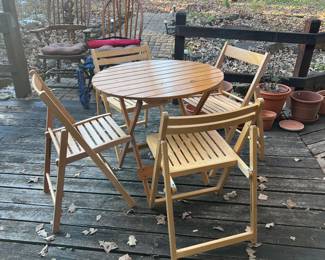 This set of four chairs and table completely collapse for easy storage
