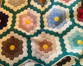 This pretty quilt is hand stitched