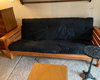 Navy blue cushion on futon