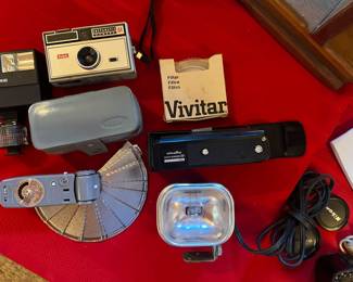 There are lots of vintage camera pieces, lenses, cords, and more at this sale. He also had many camera related books.