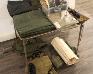 Variety of military clothing and military maps.