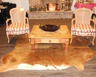 Cowhide Rug. $200.00. Table. $95.00. 39" x 36" x 17" h. Pair of Red Striped Chairs. $295.00