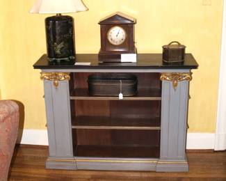 Clock on Bookcase is sold. The bookcase and lamp are still available.