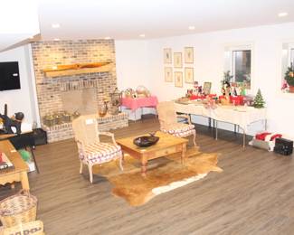 Striped chairs, table, propeller and cowhide rug sold.