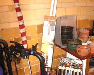 Bike rack, volleyball net, croquet set, clay pots. (Croquet set sold.)